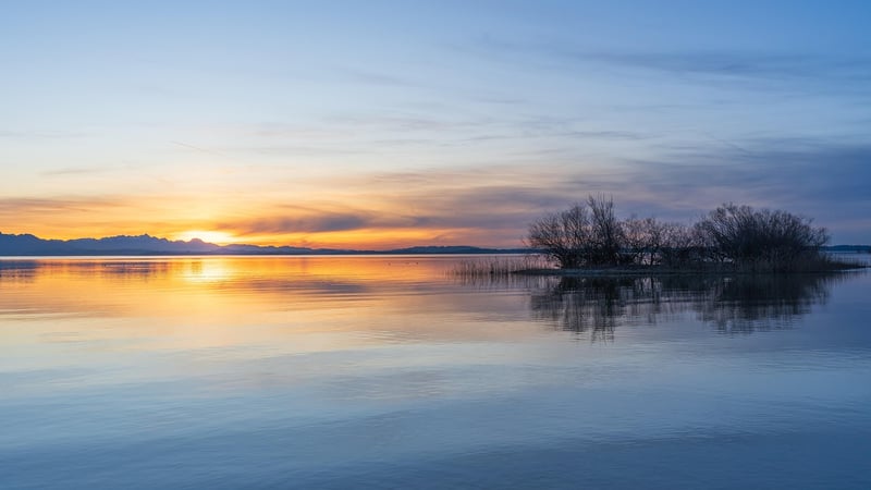 Sunrise over a tranquil lake